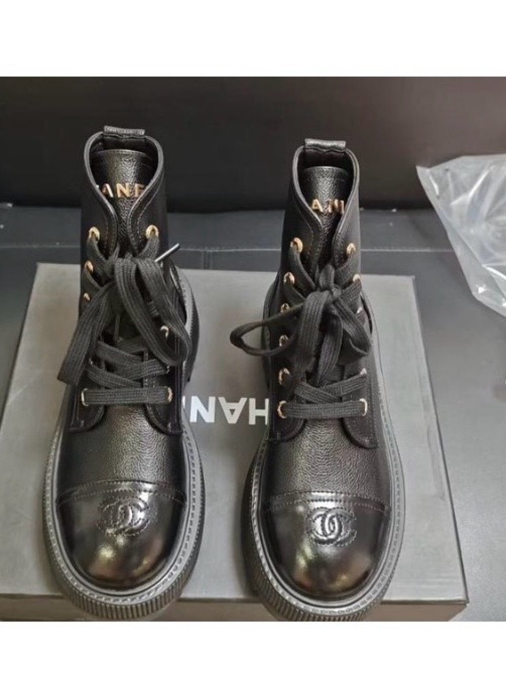 CHANEL Black Lace-Up Leather Ankle Boots with Cap Toe